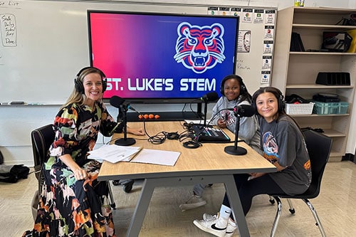 Students in recording studio with woman