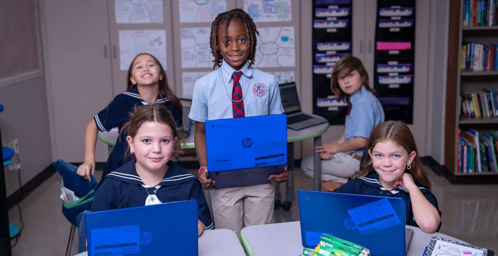 St. Luke's Episcopal School students with laptops