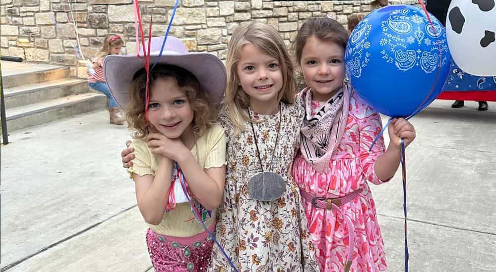 girls at St. Luke's school with balloons